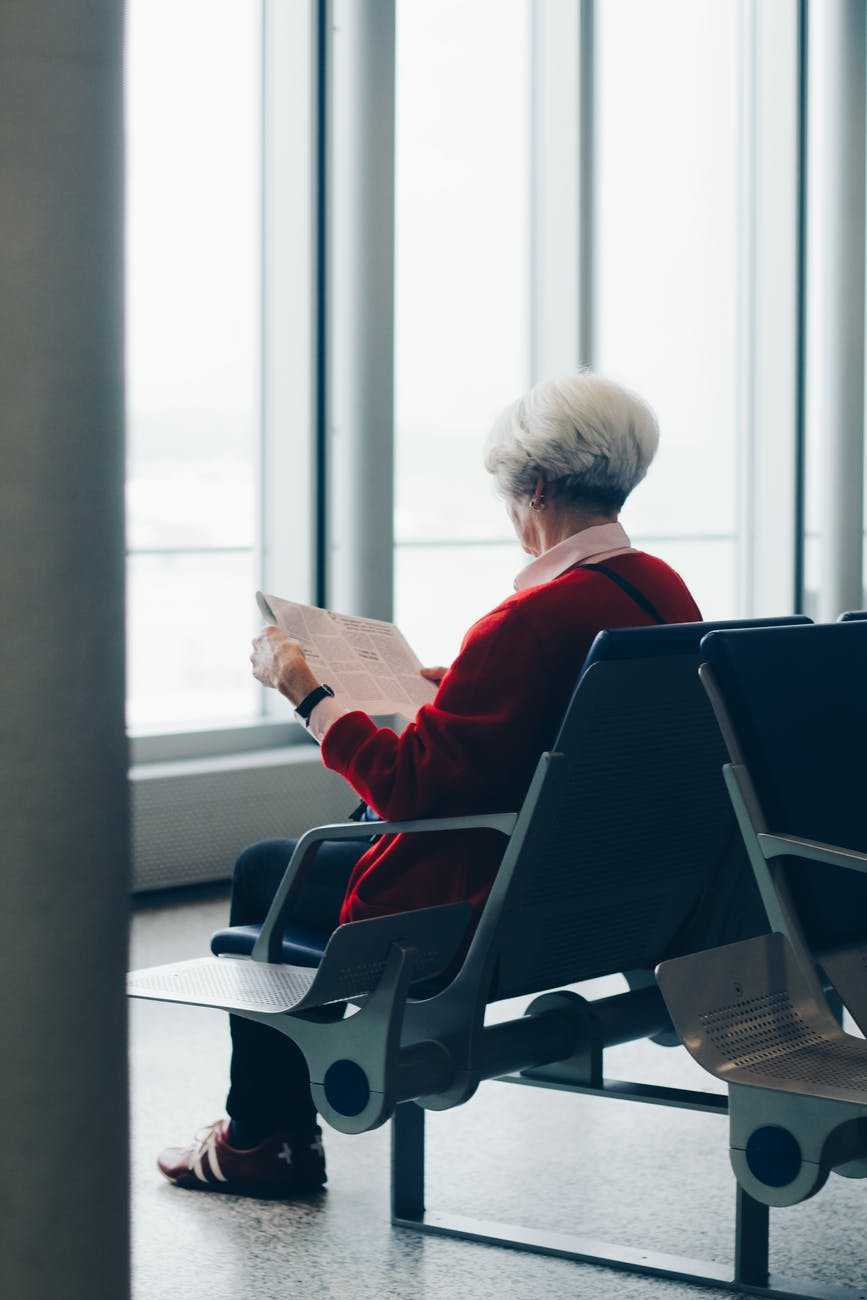 elderly lady planning reading paper